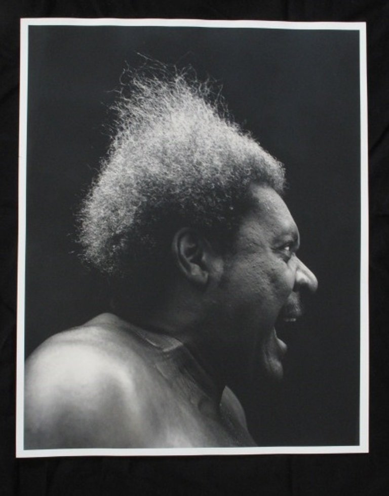 Michel Comte (1954-) Print of Don King: Black and white photographic print by Swiss fashion photographer Michel Comte. Depicting boxing promoter Don King in profile. Artist's marks in pencil to verso. 20 inches height and 16 inches width. 2