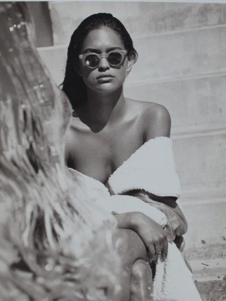 Michel Comte (1954-) Fashion Print: Black and white photographic print on baryta paper by Michel Comte. Depicting a female model in sunglasses and a white robe with an object appearing to be made of ice in the foreground. Artist's marks