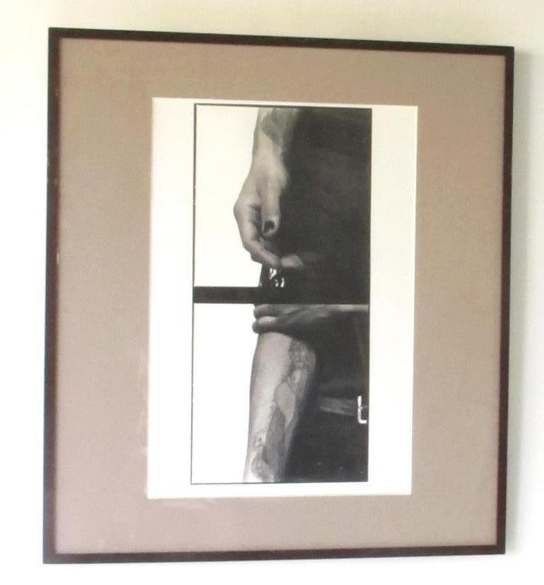 Pencil Signed Michel Comte (1954-) Print: Black and white photographic print and baryta paper by Michel Comte. Depicting a man's tattooed arm and pant waist. Print is two images spliced together with a black bar between. Pencil signed and dat