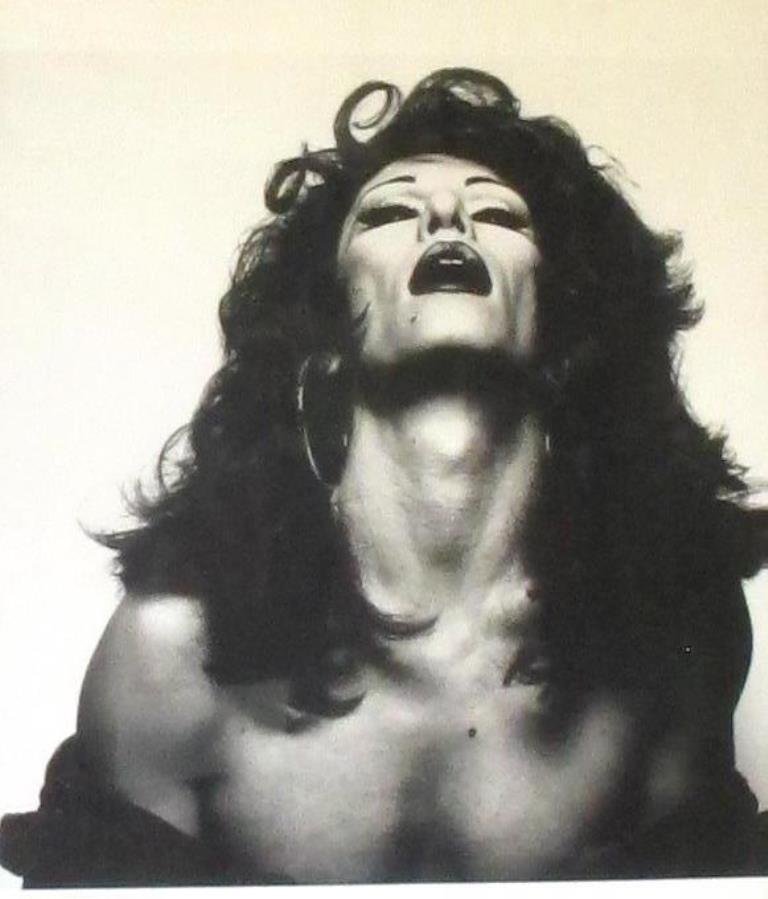 Michel Comte (1954-) Print: Print in black and white of photograph by Michel Comte depicting a drag queen. Housed in a black wood frame. 25 inches height, 21 inches width, 1 inch depth. Visual image measures 23.25 inches height