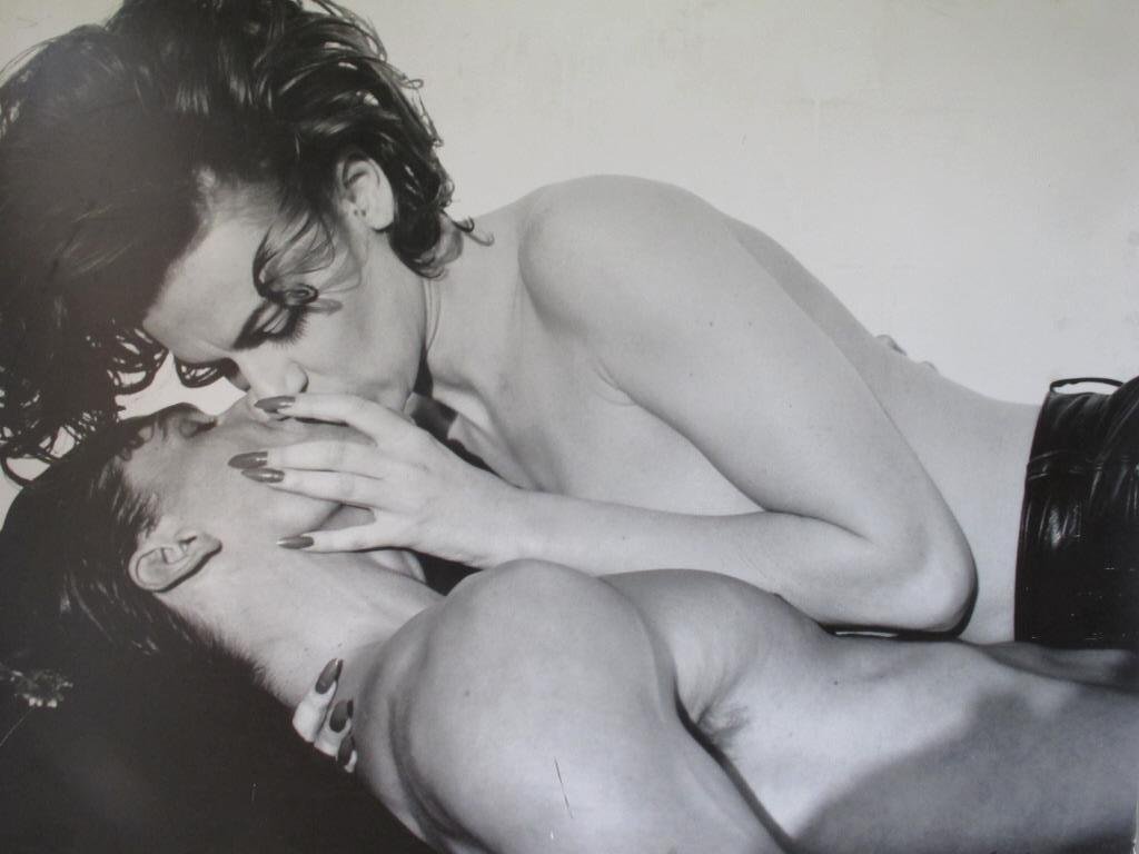 Michel Comte (1954-) Signed Photograph: Black and white print by Michel Comte signed to lower right and dated 1992. Depicting a couple kissing. Unframed. 40 inches height, 51 inches width, 0.5 inches depth. 40"H x 51"W x 0.5"D Marks, edges