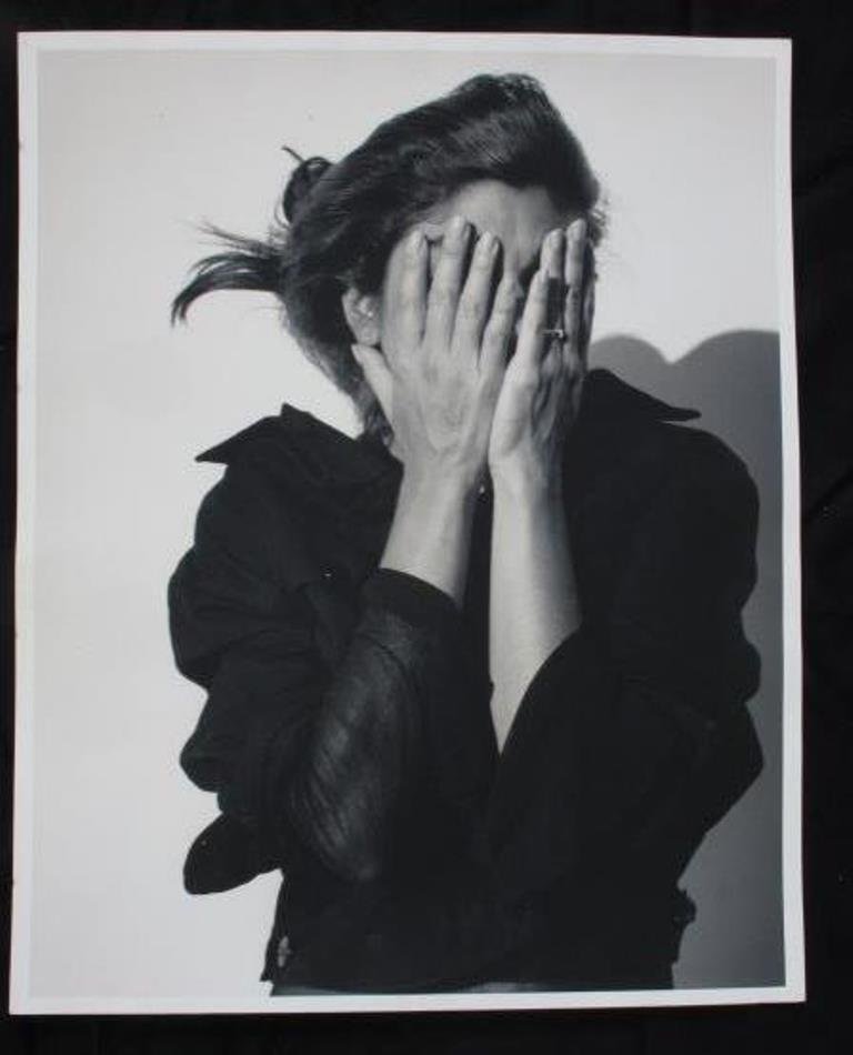 Michel Comte (1954-) Photographic Print: Black and white photographic print on baryta paper by Michel Comte. Depicting actress Laura San Giacomo covering her face. Artist's marks in pencil to verso. 20 inches height and 16 inches width. 20"H