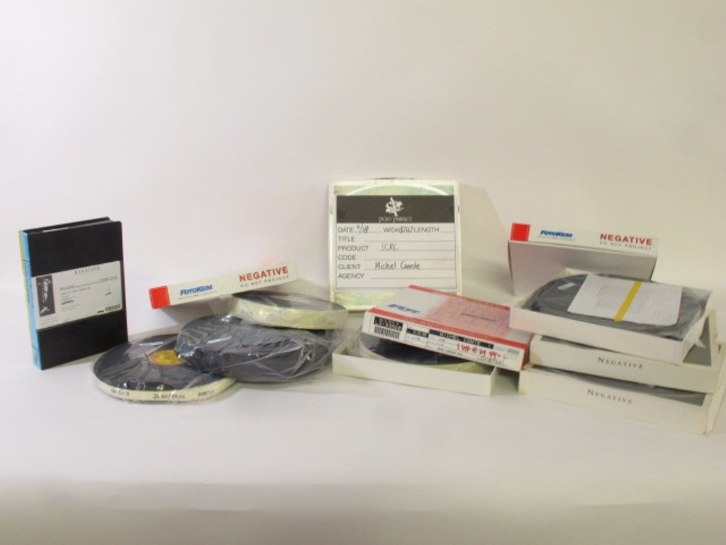 Film From Michel Comte Estate: Group of motion picture film rolls by Michel Comte. Including 16mm and 35mm film. Eight rolls total and one VHS. 13 inches height, 13 inches width, 17 inches depth for box. 13"H x 13"W x 17"D Good Dim