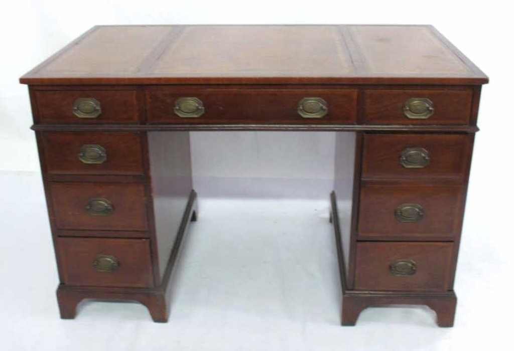 Henredon Federal Style Desk: Federal style desk made of mahogany. Having one center drawer reading "Henredon" inside and four drawers on each of two ends. Surface is decorated with three rectangles bordered with printed gilt foli