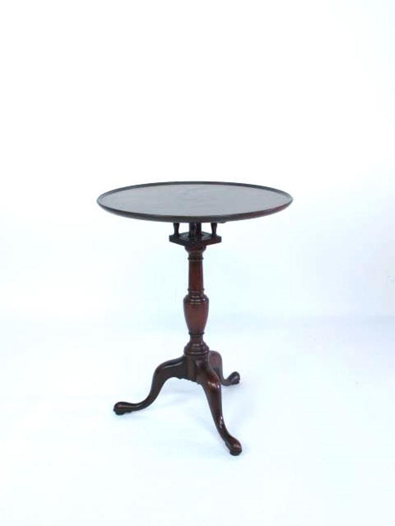Mahogany Tilt Top Table: Having three legs with paw feet and birdcage flip top mechanism 28.25" H x 21.5" Diameter Good used Dimensions: 28.25" H x 21.5" Diameter