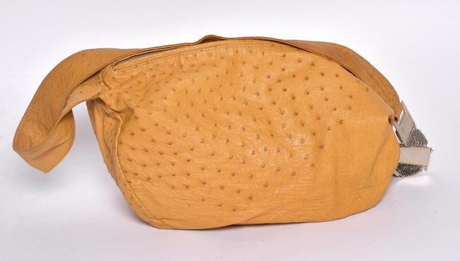 Santesteban Ostrich Skin Shoulder Bag: Orange ostrich skin fitted with a shoulder strap with chrome chain mail and fitted with agate stone links. 12 inches height, 18 inches width. Provenance: From a Private Collection of Prestigious Saras