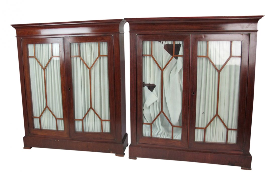 Pair Glass Paneled Cabinets Pair of cabinets having 2: Pair of cabinets having 2 glass paneled doors to each with geometric detail. Fabric shades to doors. Mahogany frame with rectangular form. 52 inches height, 44.5 inches width, 12 inches depth. 52"H x 