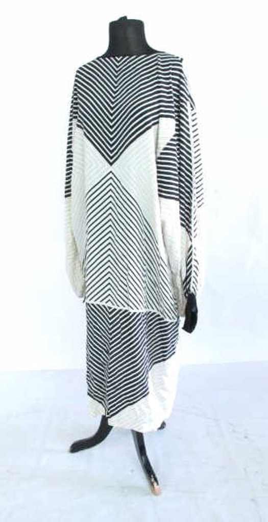 Black and White Print Dress Silk dress having overall: Silk dress having overall black and white striped geometric print. Caftan silhouette with tie back. Size medium. 45 inches length, 18.5 inches shoulder to shoulder. 45"H x 18.5"W Measurements: 45"H x 