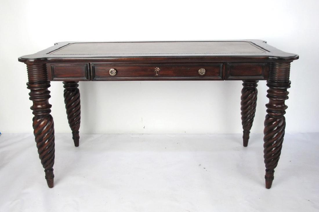 Tommy Bahama Leather Top Writing Table 20th century,: 20th century, decorative. Inset all of colored leather top with marquetry inlaid palms at each corner of the top fitted with a single drawer on twist turned legs. Some marks and dings to finish with s