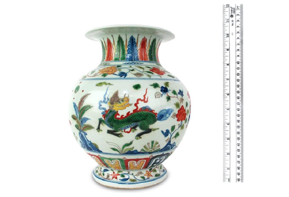 Wu Chi Porcelain Ming Dynasty w/ Xude Mark: Chinese porcelain vase having hand painted dragon and foliate motif throughout. Rounded in form. Dominant red, blue, and green tones. 10.5 inches height, 9 inches width, 9 inches depth. 10.5"H x 9"W x
