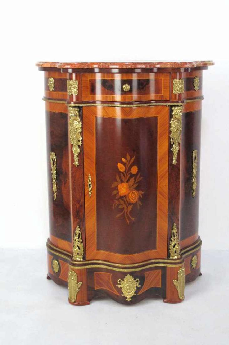 M/T French Credenza Small: Credenza having curving form with brown marble top, burled wood accents to front, single drawer and single door having floral marquetry inlay. Gilt bronze mounting throughout with foliate and figural 