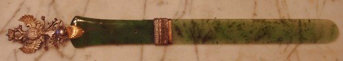 Faberge Jade Letter Opener Hallmark: Jade, ruby and gold letter opener by Faberge features spinach jade (nephrite) handle and blade, two-headed Czarist eagle, one large ruby, seven small rubies. Hallmark Faberge (in Russian) "56" for 56 