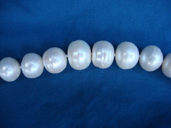 13-15mm Australian Baroque Pearl 36" Strand AAA: Australian South Sea white baroque pearls. Large 13-15mm size pearls in this full size 36 inch strand of beautiful AAA quality pearls. This piece is 100% guaranteed genuine. Smaller 17" neclaces of si