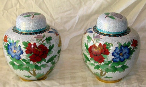 Pair of Chinese Cloisonne Vases Matching Lidded: This beautiful hand made matching "mirrored" (balanced individual opposites) pair of Chinese cloisonne vases with lids features red, blue, yellow and pink roses which represent beauty and love with bl