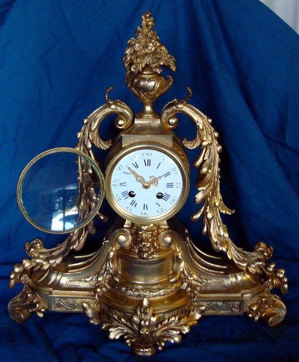 Antique French Clock 19th Century Gilt Bronze Man: Elegant large stately gilt bronze 19th Century French clock with exquisite French two train movement and beautiful sounding fine French silver bell, strikes on the hour and half hour. Runs great, keep