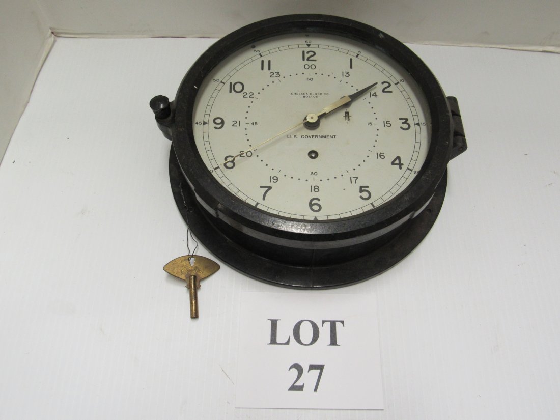 CHELSEA SHIP'S CLOCK: BLACK BAKELITE SHIP'S CLOCK MARKED U.S. GOVERNMENT. KEYWIND. WORKING WITH ORIGINAL KEY. 10 1/2" ROUND.