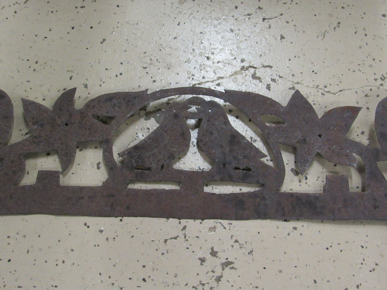 METAL FOLK ART HANGING: HAND CUT METAL FOLK ART HANGING FEATURING CUT OUT FLOWERS, BIRDS AND HEARTS. PENNSYLVANIA DUTCH. 34 1/2" LONG X 24" TALL