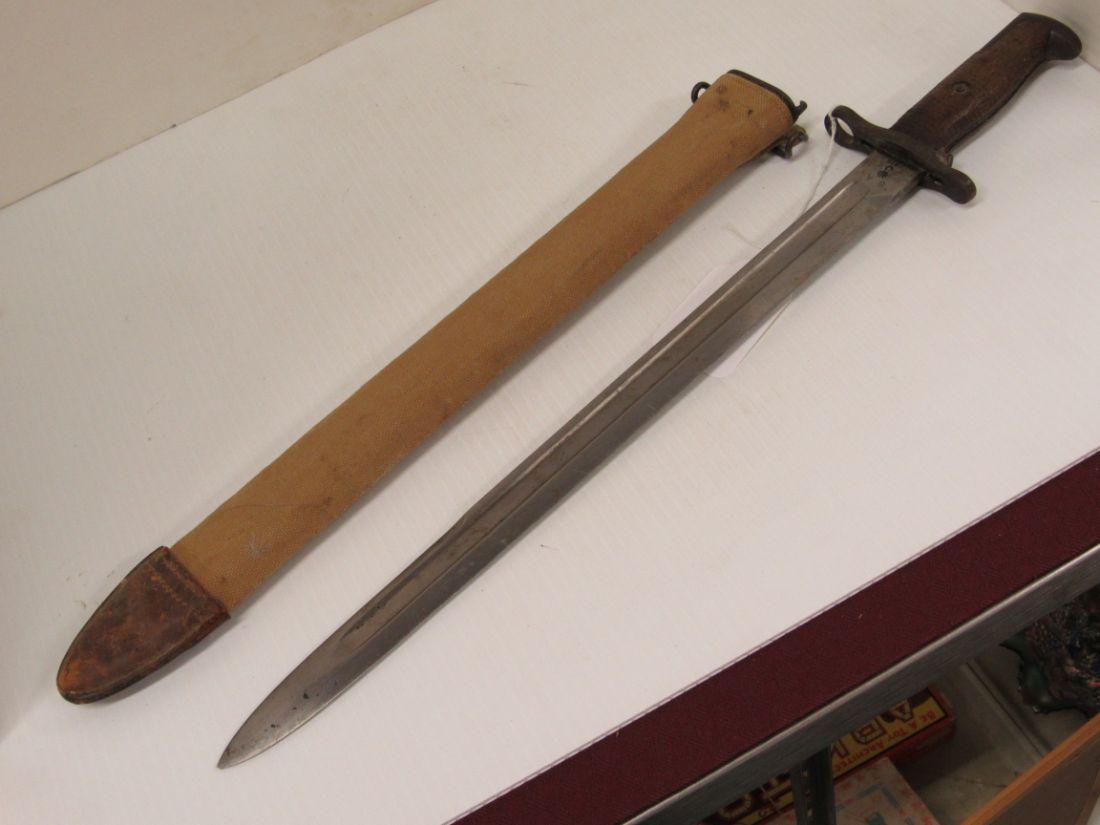 U S WWI BAYONET: U.S. WWI BAYONET. MARKED S A 1915, U.S. SERIAL # 625104. COMES WITH LOCKING SCABBARD AND CANVAS / LEATHER COVER. GREAT CONDITION. 21 1/2" LONG