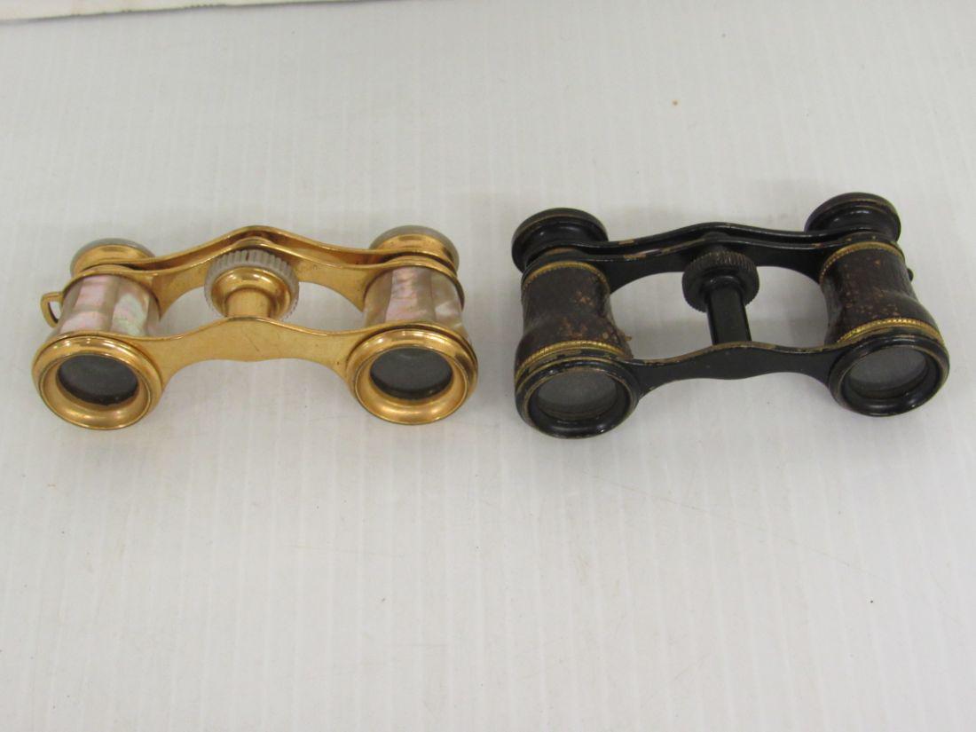 TWO PAIRS OF OPERA GLASSES: ONE SMALL MOP PAIR AND ONE LEATHER COVERED. FRENCH MADE. PURSE-SIZE. 3 1/2"