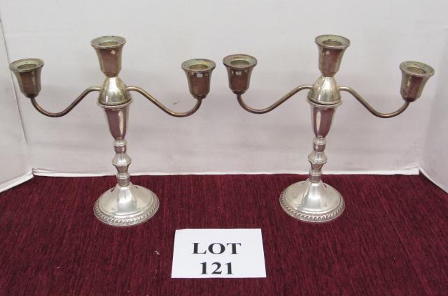 Sterling silver: Pair of matching sterling weighted 3 candle candelabras with screw on tops to convert down to 1 candle. 10" tall.