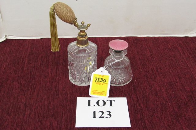 Perfumes: Two cut glass perfume bottles, one with atomizer, the other with long stopper. 8 1/2" tall and 4" tall.