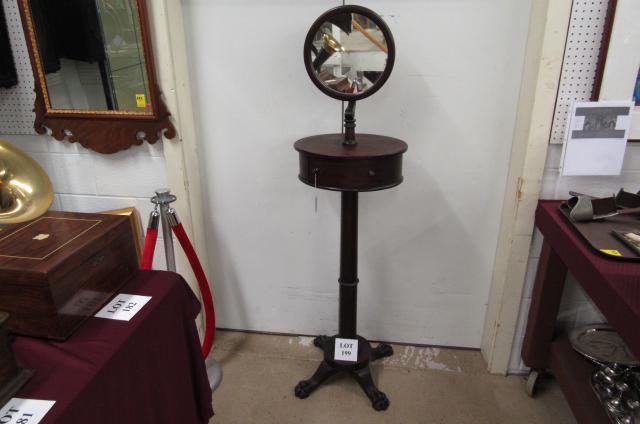 Shaving Stand: Victorian mahogany shaving stand, oval-shaped table top, single drawer, round adjustable mirror, claw foot base. Pick up Only. We will not ship. 66" tall. Base is 17" square.
