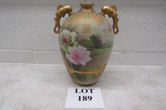 Nippon Vase with Dolphin Handles: Elaborate Gold Design Floral Landscape Nippon Vase with Dolphin Handles, Blue Leaf Mark, Measures 9" w x 10-1/2" h, Gold Wear on Rim