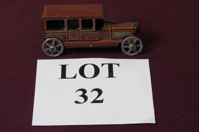 Red Brown German Tin Litho Limo Coach with Driver: Red Brown German Tin Litho Limo Coach with Driver, Marked CF on both Sides, Measures 4-1/4" l x 1-1/2" w x 2" h, Paint Loss and Oxidation