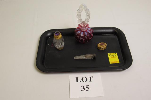 Dresser Items Including: Cranberry Perfume Bottle: Dresser Items Including: Cranberry Perfume Bottle, Gold Tone Pill Box with Amethyst Colored Accents, Glass Perfume Bottle with Gold Tone Top, and Silver Plate Bottle
