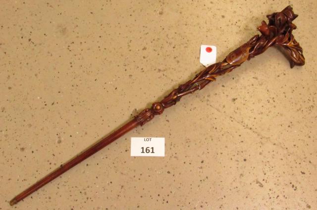 Spectacular Hand Carved Wood Walking Stick Cane with: Spectacular Folk Art Hand Carved Wood Walking Stick Cane with Birds in Trees, a Snake, Insects and a Small Owl. Cartouche marked Palms. Master carver! Measures 37" l