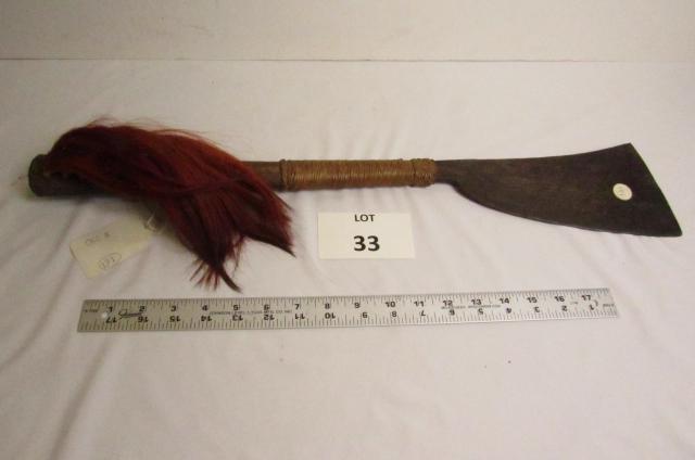 Headhunters Machete: Dao Headhunters machete from Burma. Iron blade and wood handle with red dyed goat hair on handle. 24" L blade, 4 1/4" W. Circa 1920.