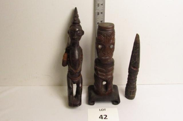 Carved Figures and knife: African carved wood figure of a man with pointed cap 11 1/2" T, Oceanic totem with mop eyes on a stand 10 1/4" and a hand carved wood knife 9" L.