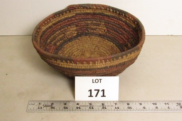 Woven basket: Round woven basket multi colored. South American or Mexico? 10" across, 3 1/4" tall
