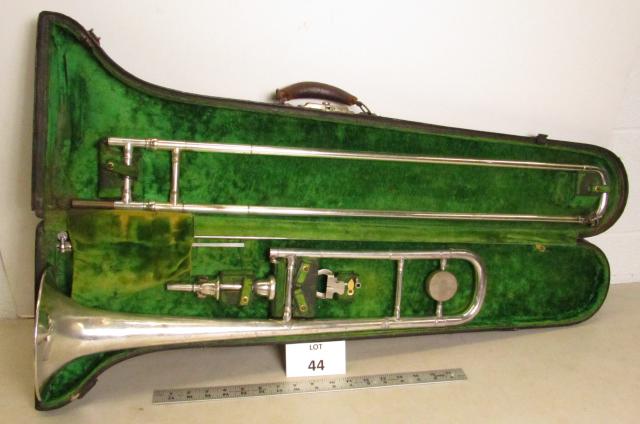 Buescher Trombone: Buescher trombone with two mouthpieces, cleaning rod and music holder in original leather case.