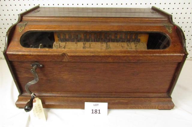 Grand Roller organ: Rare Grand Roller Organ. 13 1/8" wood cobb. Much larger than the Concert Roller Organ. 25" long, 16" deep, 13" tall. With one cobb. Oak case. Pick up only. We will not ship due to size and weight limi