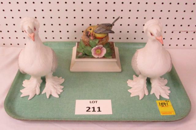 Boehm bird figurines: Lot of 3. A pair of Boehm Tumbler pigeons and a Prothonotary Warbler. Pigeons 8 1/2" tall and 11" long, Warbler 6" L x 5 1/4" D x 5 3/4" T.