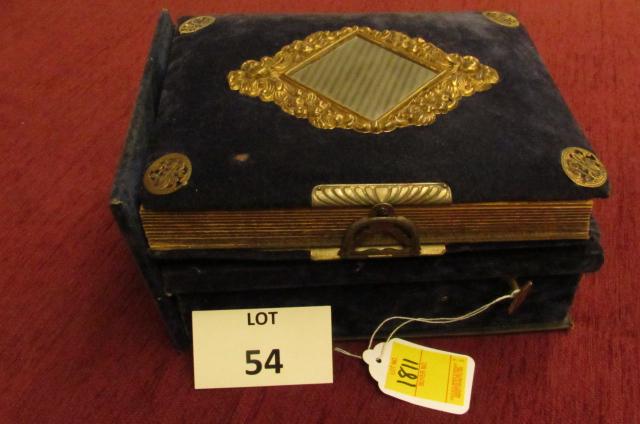 Early photo album with music box: Early photo album with music box, decorated and covered with blue velvet and mirror, music box is in working condition; over two dozen portraits, including many children and several tin types ( measur