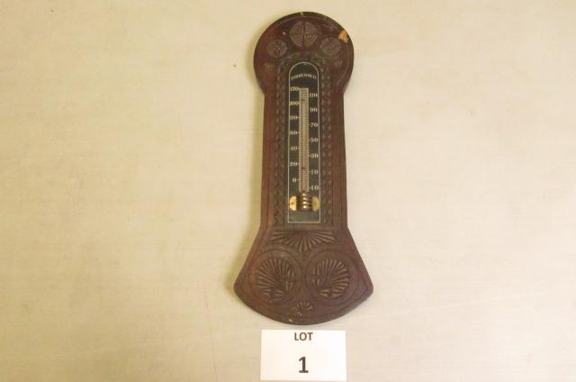 Hanging wooden wall thermometer with carved decorations: Hanging wooden wall thermometer with carved decorations. Measures approximately 15 " x 5 3/4"
