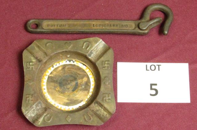Lot of two items decorated with swastika's 1. Early tin: Lot of two items decorated with swastika's 1. Early tin ashtray from the "Panther Oil and Grease Manufacturing Co." 2. Cast metal gate latch from the "Buffum Co., Louisiana, MO" **Disclaimer**: Given 