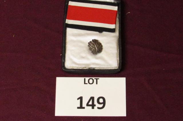 WWII German oak leaves cluster with ribbon in original: WWII German oak leaves cluster with ribbon in original presentation case **Disclaimer**: Given COVID-19 restrictions and the influx of replicas on the market, we are unable to authenticate some of the