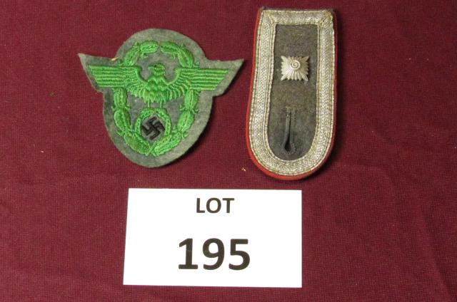 WWII German military police patch and a shoulder strap: WWII German military police patch and a shoulder strap **Disclaimer**: Given COVID-19 restrictions and the influx of replicas on the market, we are unable to authenticate some of the German Nazi items