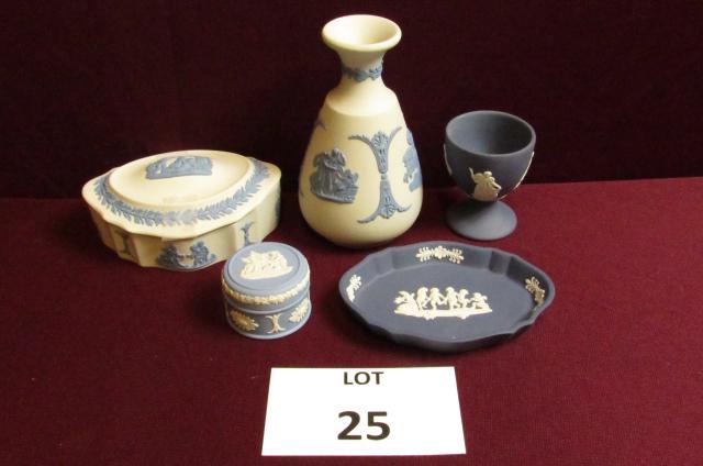 Wedgwood lot: Lot of 5 Blue and White Wedgwood. Includes an egg cup, 2 covered vanity boxes, a small dish and vase. Vase is 5" tall