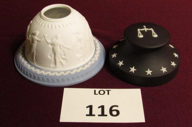 Wedgwood pottery: Lot of 2. Wedgwood paperweight white jasper over black basalt with scales of justice decoration 1 3/4" tall x 3 1/2' wide and Votive candle dish with cover, white jasper over blue with classical decor