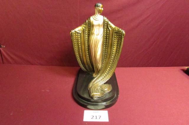 Erte' La MystÃ©rieuse" bronze: Erte' La MystÃ©rieuse bronze sculpture. A gilded bronze figure cast from a model by Erte' of a young woman wearing a long silver dress with a shawl over each extended arm, each decorated with geomet