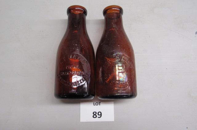 Two amber 1 quart milk bottles (1 of 3)