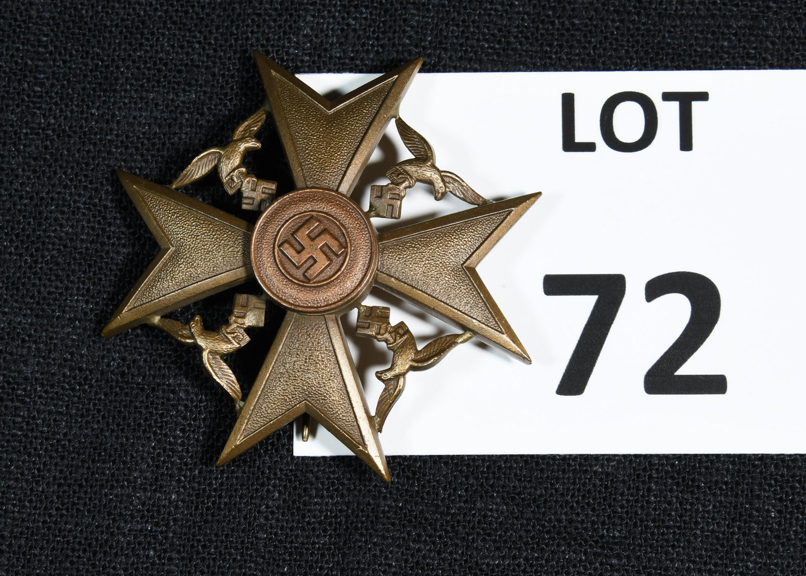 Spanish Cross Legion of Condor Badge: A bronze Spanish cross Legion of Condor badge. Awarded by Nazi Germany to German soldiers who participated in the Spanish Civil War. This badge features a a Maltese cross with a swastika at the center