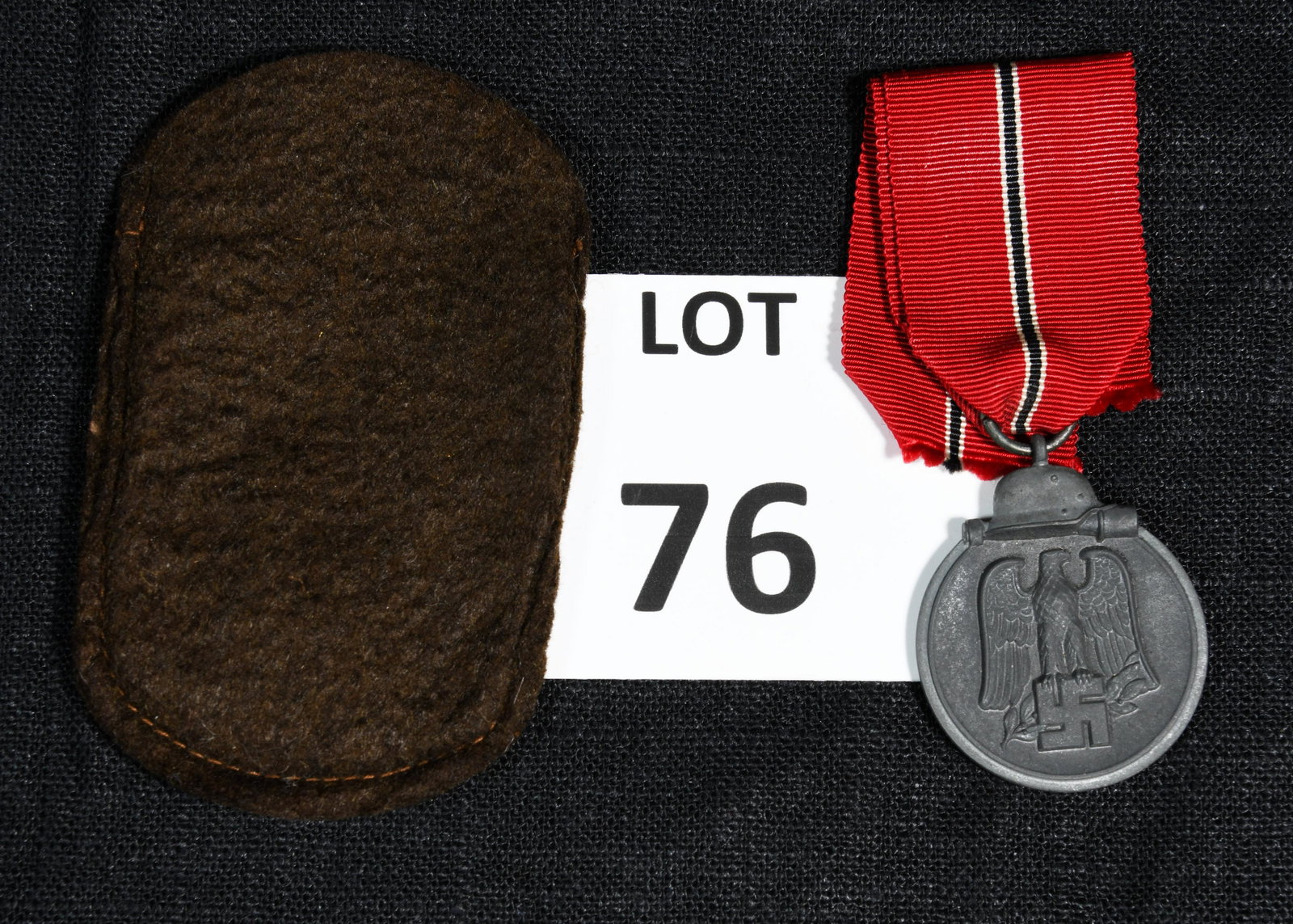 German WWII Eastern Front Medal: An Eastern Front medal awarded to members of the Wehrmacht who served in the Soviet Union during the Winter Battle in the East 1941-42. This medal is made of zinc and features the German eagle and swa