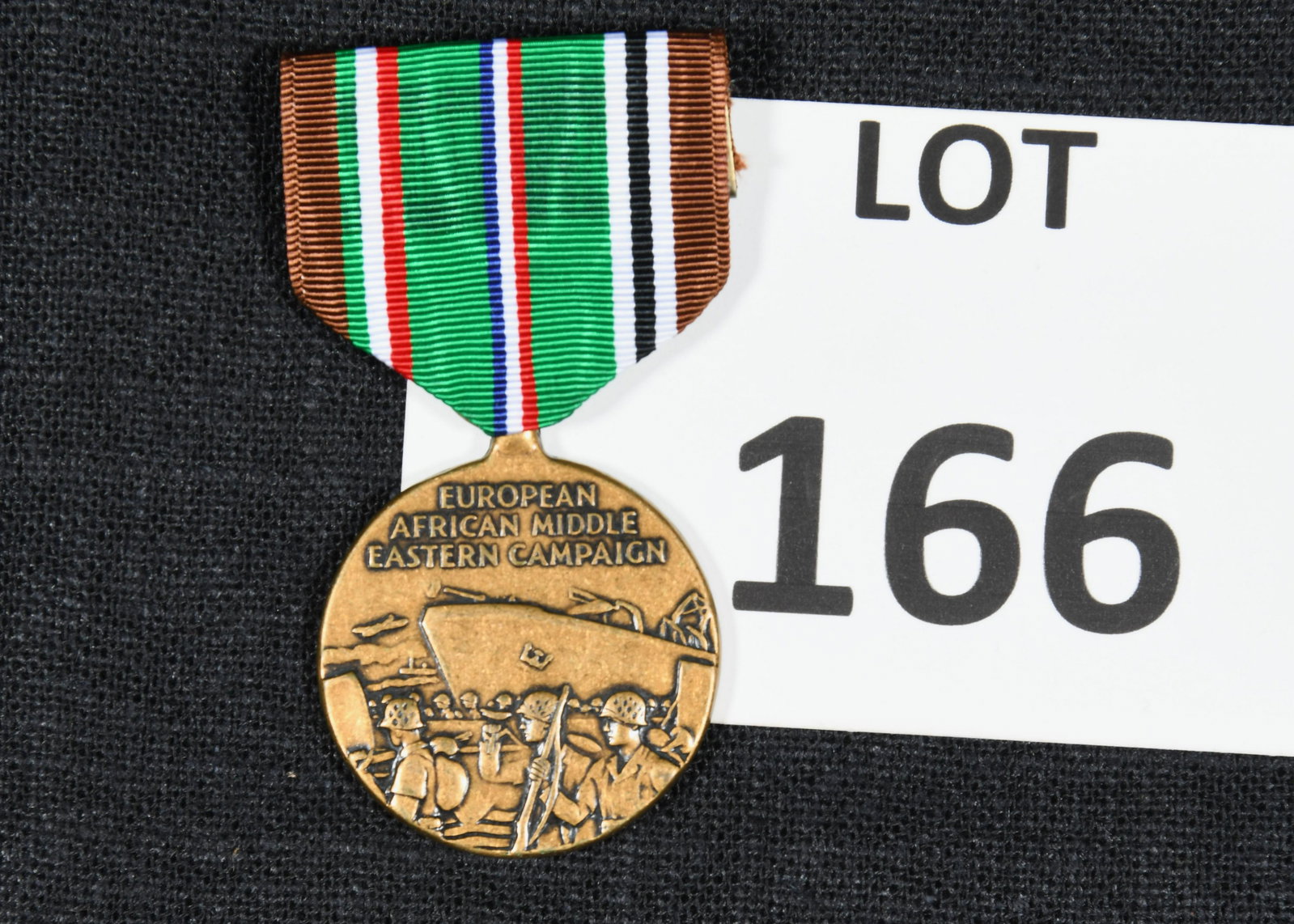 WWII Era European African Middle Eastern Campaign Medal: A WWII era European African Middle Eastern Campaign medal. This medal was awarded to members of the military who participated in the European Theater during WWII. This award is attached to a green, re