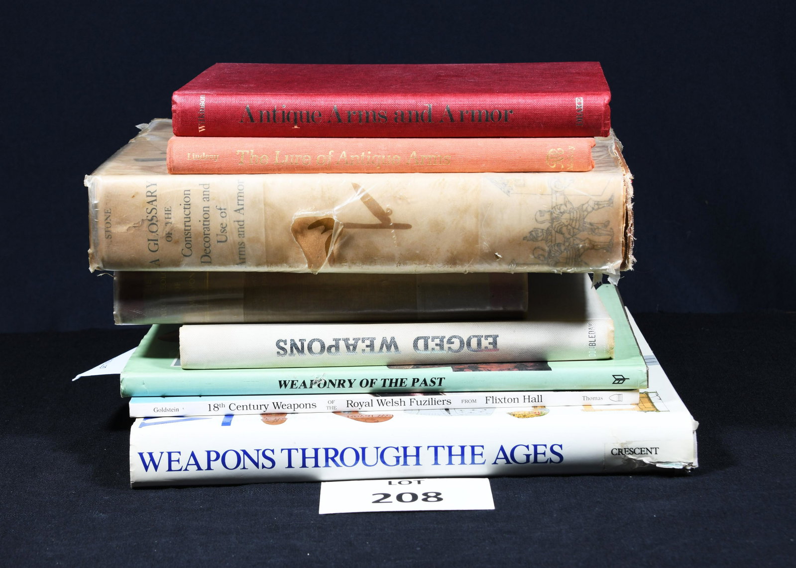 Selection of Books Relating to Antique Weaponry: A collection of 8 books about antique weapons. *notes- book cover and sleeve damage, overall wear from age.