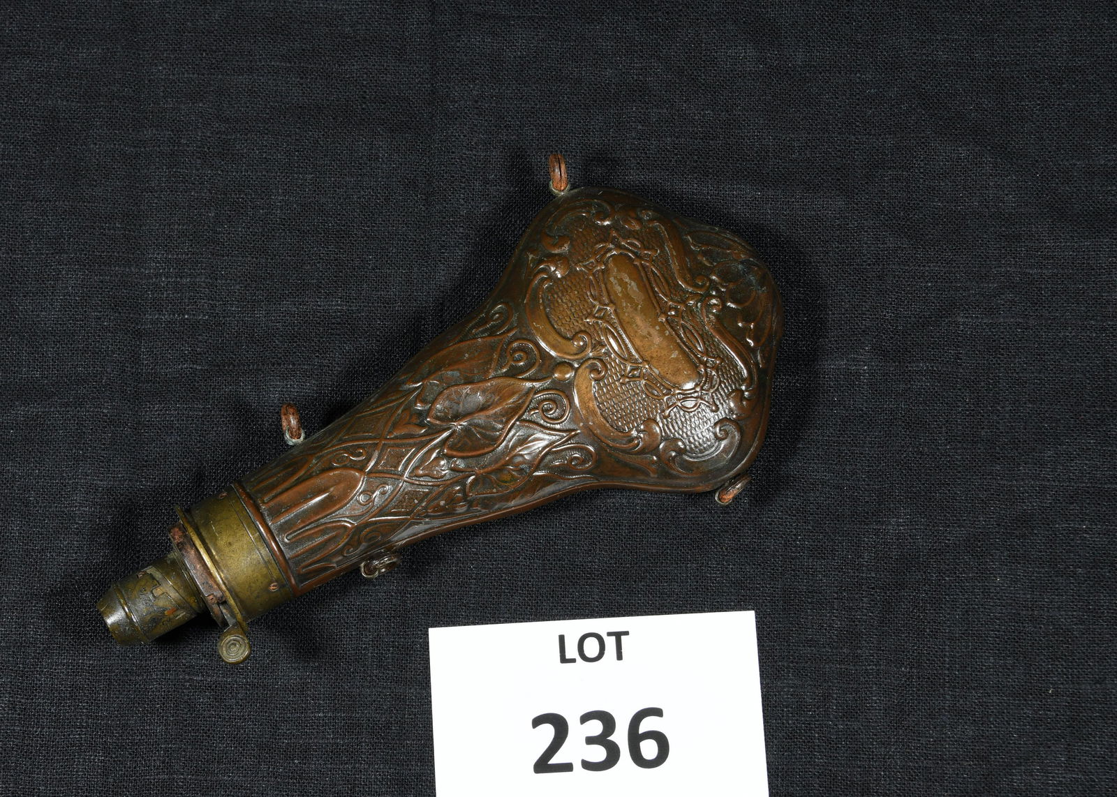 Civil War Era Powder Flask: A Civil War era brass gun powder flask with ornately carved pouch.8" long. *notes- Some scratching and scuffing to metal.